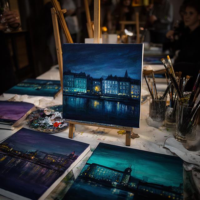 Blue and teal cityscape paintings inspired by Dublin at a guided evening workshop